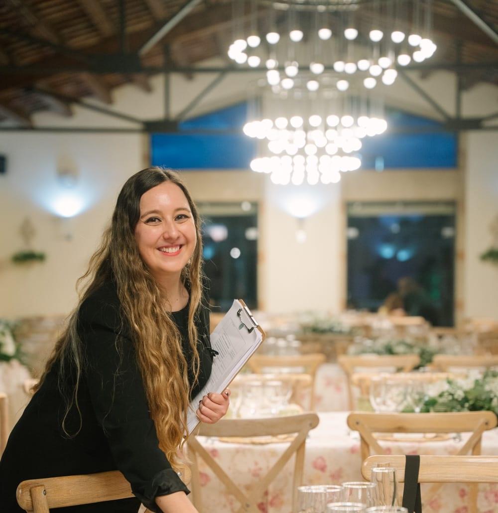 A beautifully laid wedding table with elegant floral arrangements and tableware, bathed in warm, soft light, perfect for a luxury celebration.